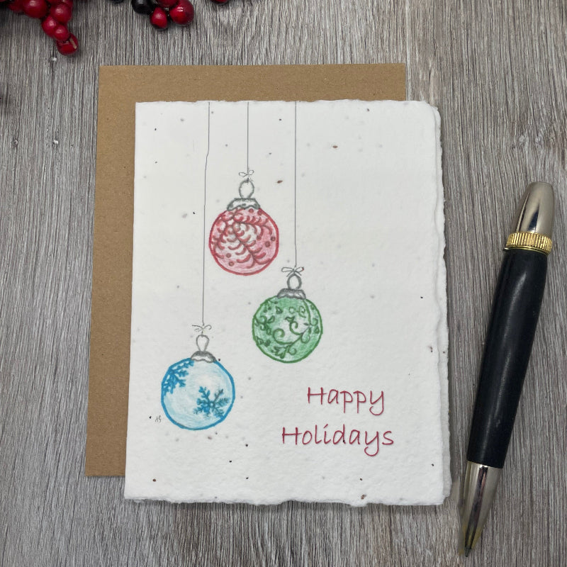 christmas card with ornaments made of plantable seed paper. wildflower seed paper. vintage artwork from watercolors.