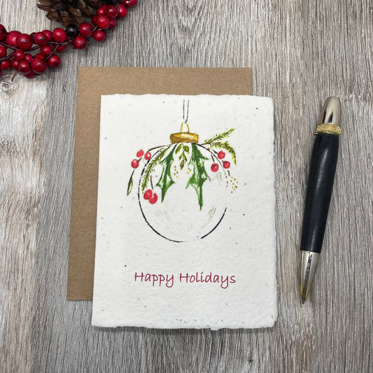christmas or holiday card with an ornament watercolor design.  Plantable seed paper that grow wildflowers. 
