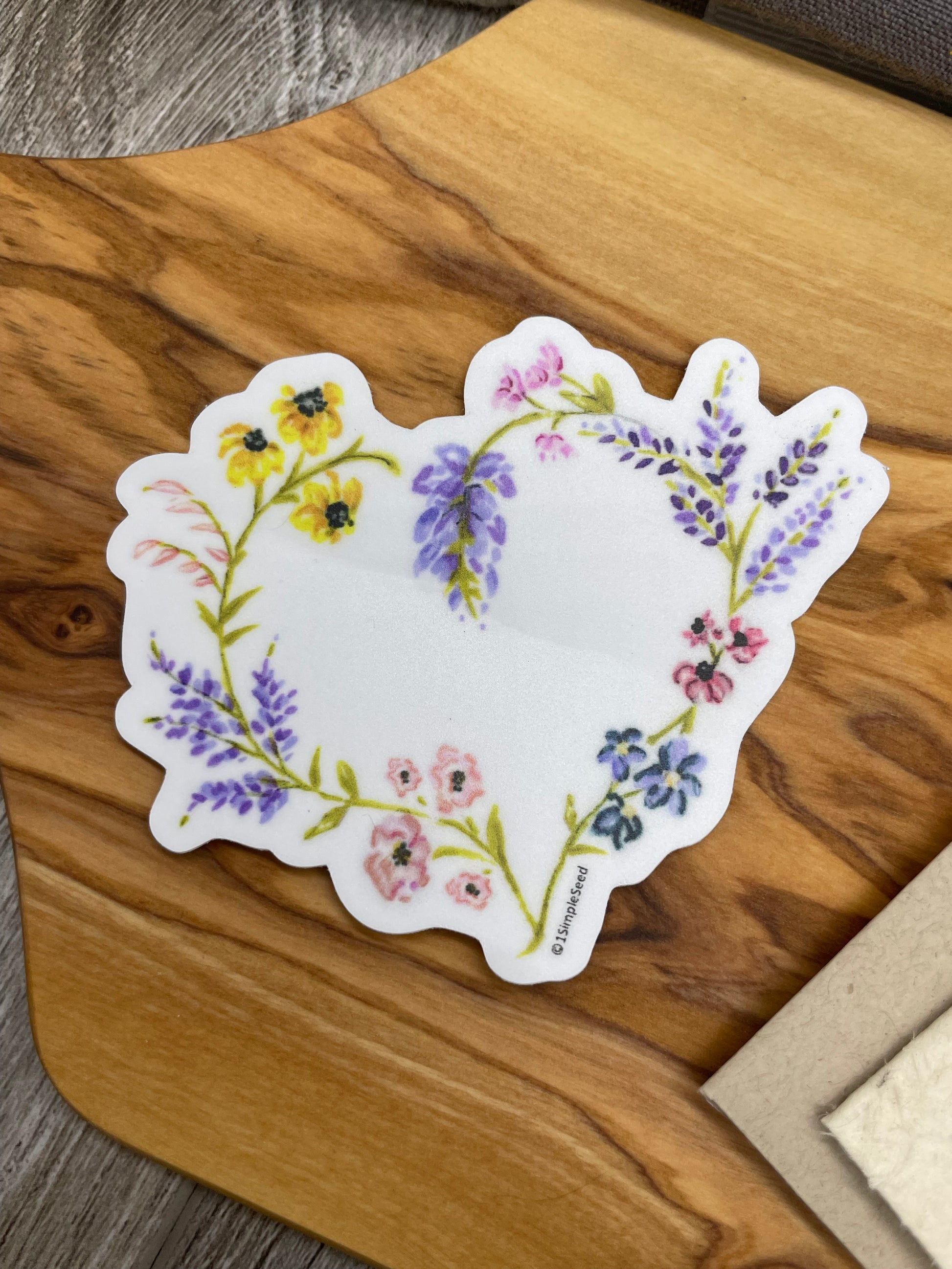 Show off this pretty wildflower heart sticker on your water bottle, laptop, phone or notebook.  Our stickers are colorful and made to last.

🌺Size & Information:
    -3" x 2.52"
    -Dishwasher and microwave safe
    -2-4 year outdoor life (UV resistant, weatherproof, waterproof, scratchproof & fadeproof)

🌺Application Instructions:
    Remove paper backing and apply at a moderate temperature (50º-80º F) to a clean and dry surface. 

🌼Shop our matching Plantable Greeting Card: https://www.etsy.com/listin