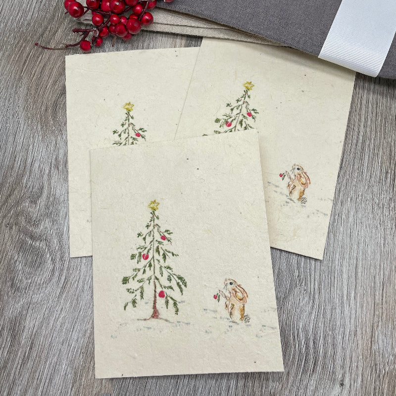 rabbits bunnies bunny. holiday christmas plantable cards. wildflower seeds. holiday cards. merry christmas bulk cards. 