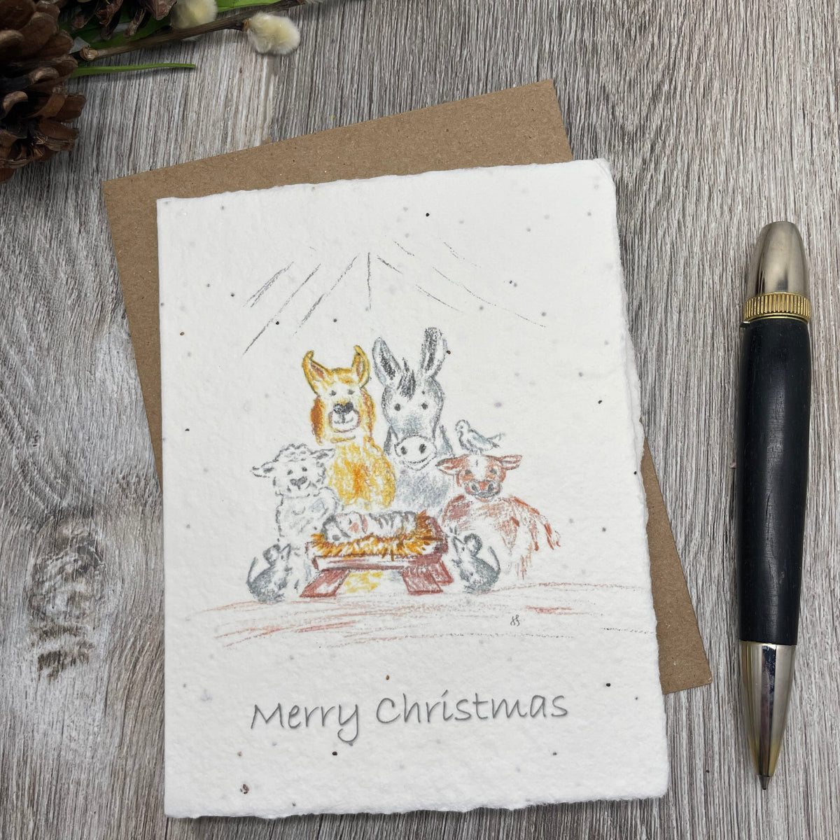 Manger. christmas card with manger scene. watercolor design of holiday greeting card made from plantable seed paper that grows wildflowers